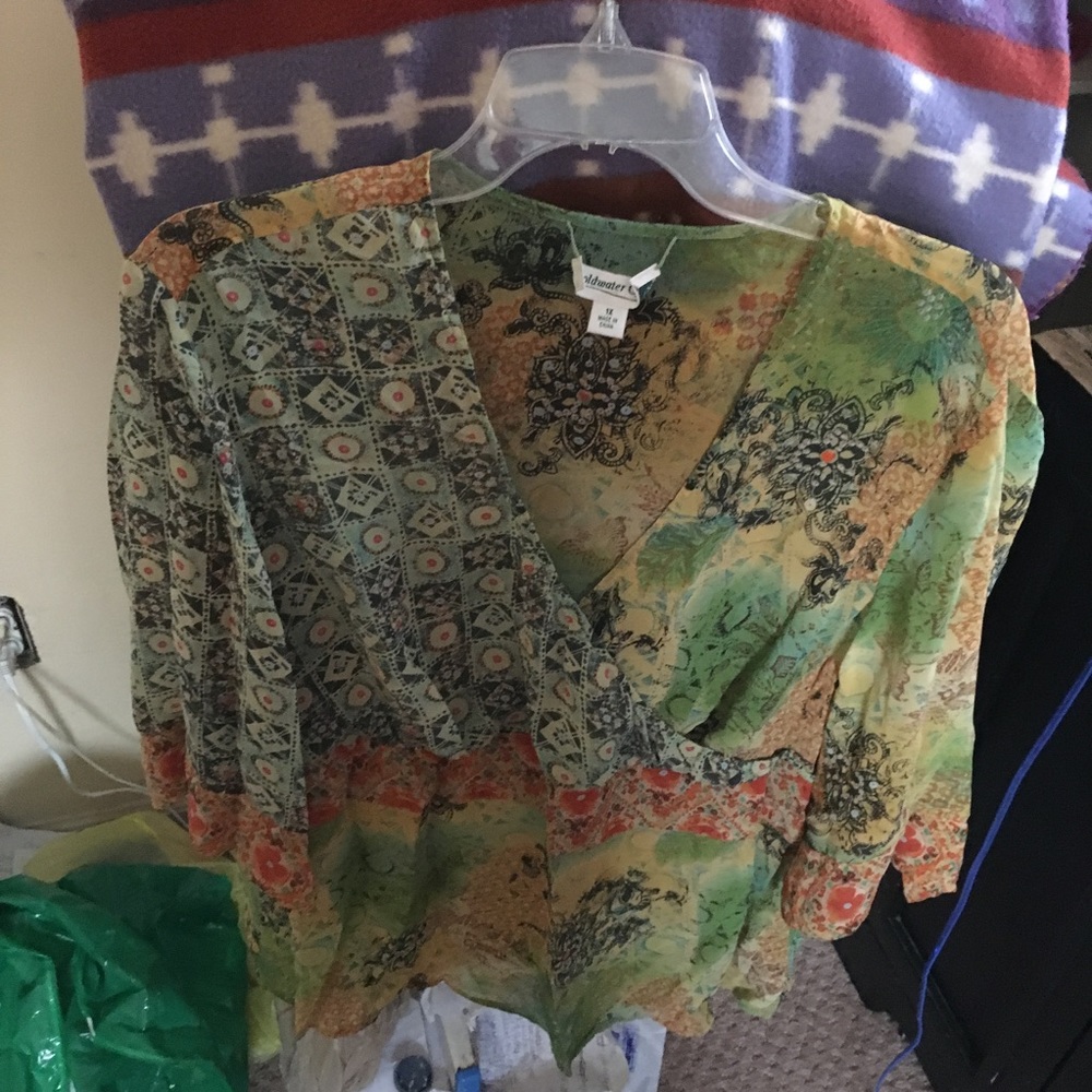 Blouse in green flowers. Sheer