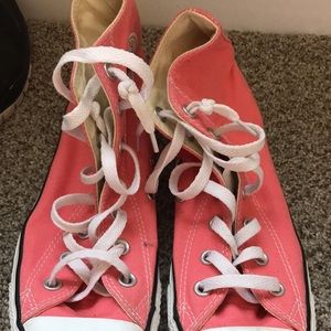 Pink women's high top converses
