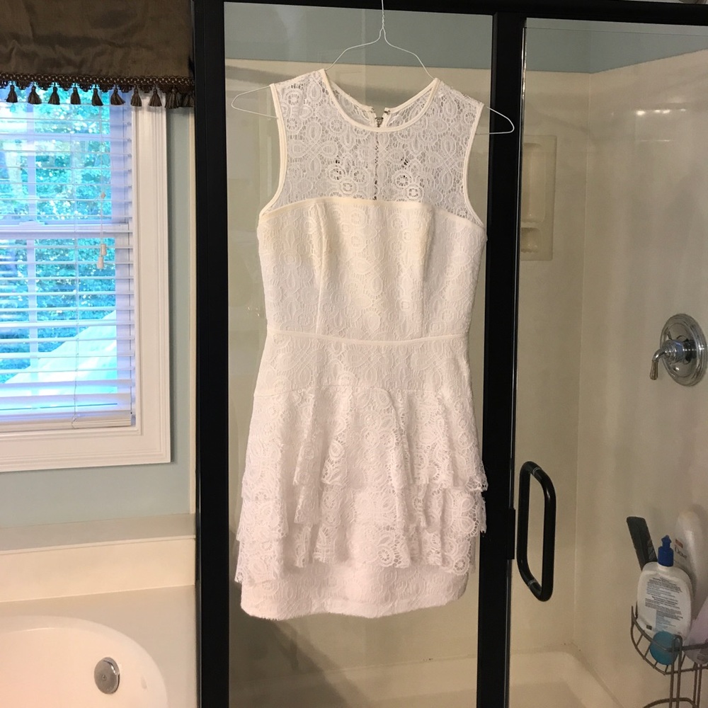 Bebe Lace White Dress with ruffles on bottom front