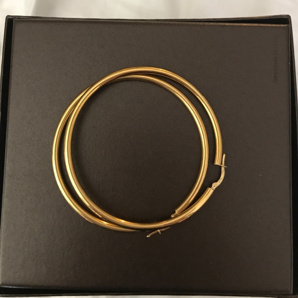18 carat gold large hoop earrings.