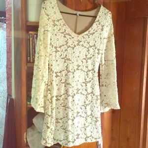 White lace dress with tan underneath