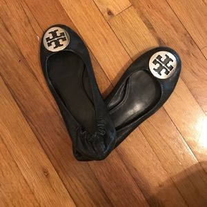 Black Tory Burch flats with silver logo
