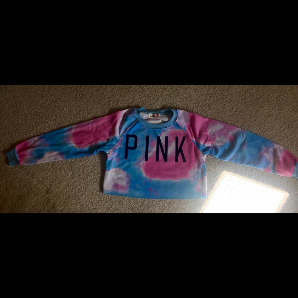 A cropped long-sleeve top