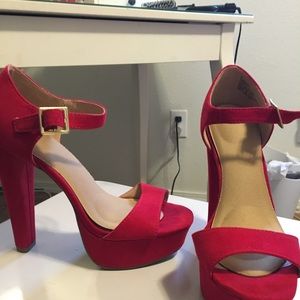 Red suede pumps