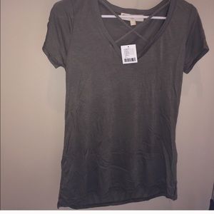 Super soft army green tee with cross detailing.