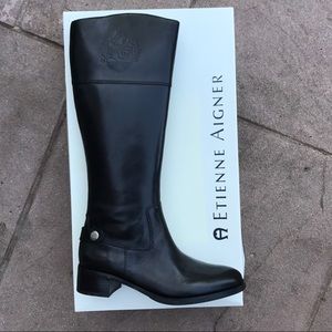 Tall black riding boots