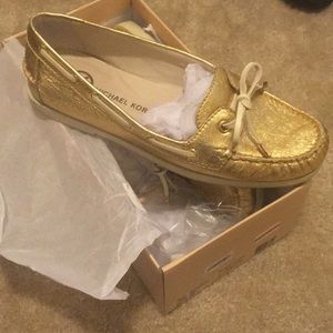 Gold Michael Kors boat shoe
