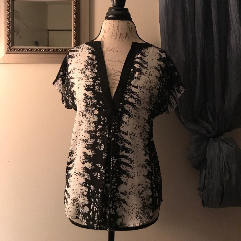 Deep V-neck black and white dressy top