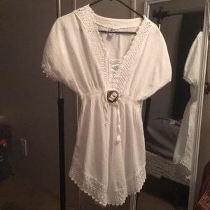 A white "made in Peru" sundress