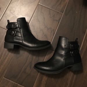 Black booties with double buckle detailing on side