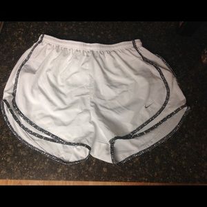 White Nike running shorts