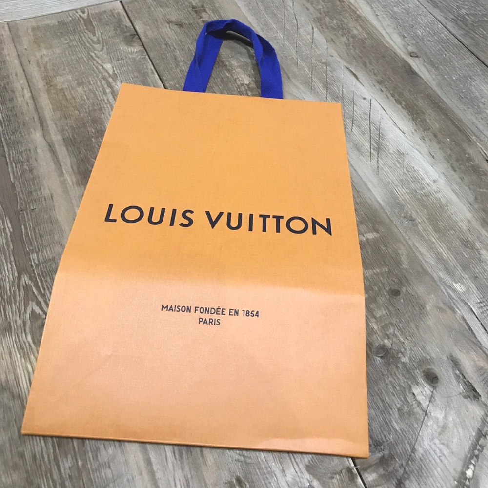 Louis Vuitton bag, ribbon and cleaning cloth