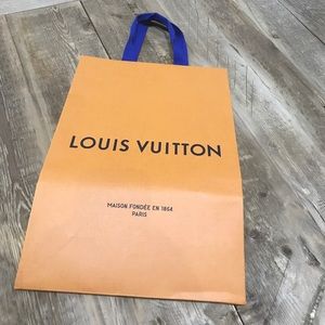 Louis Vuitton bag, ribbon and cleaning cloth