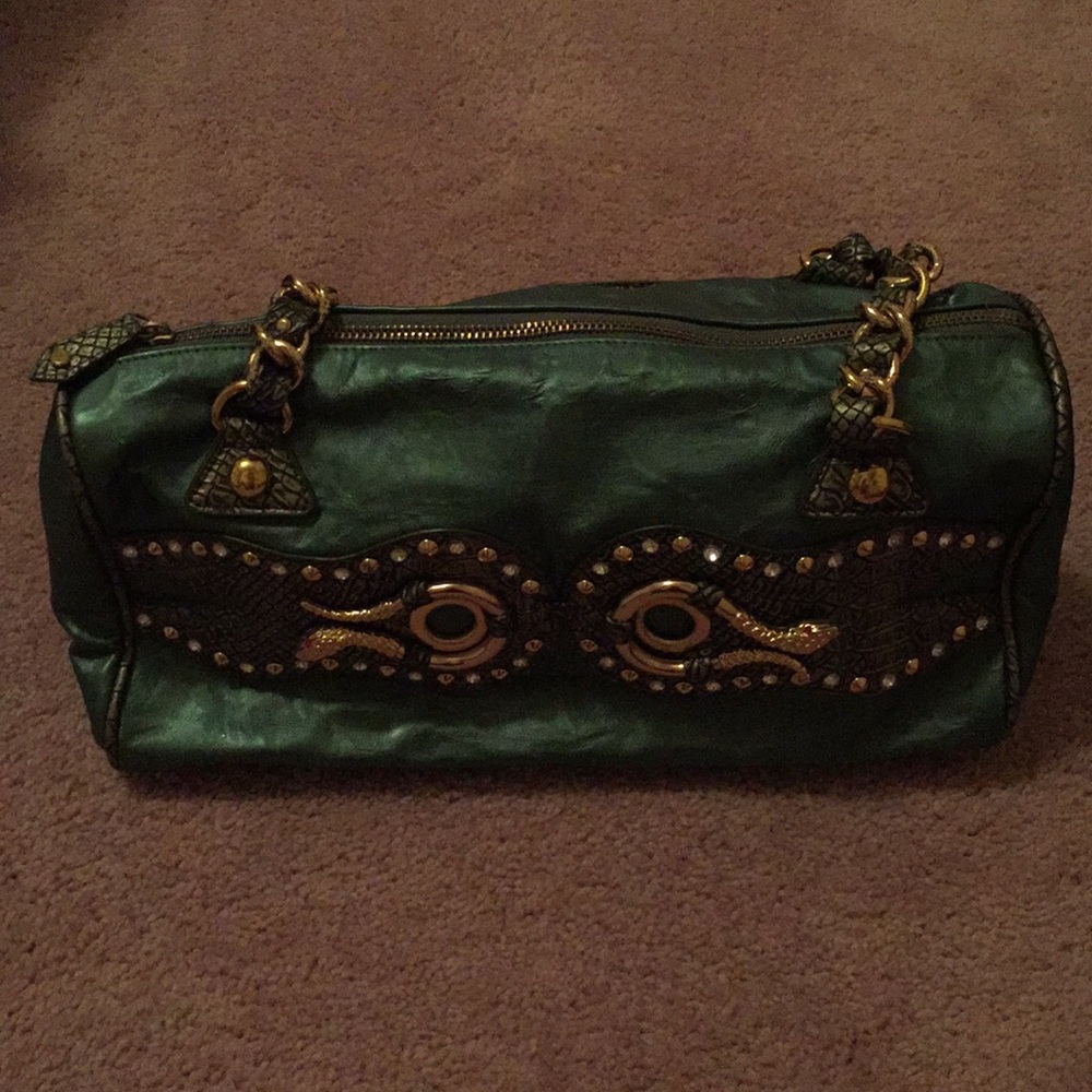 Green purse with gold accents