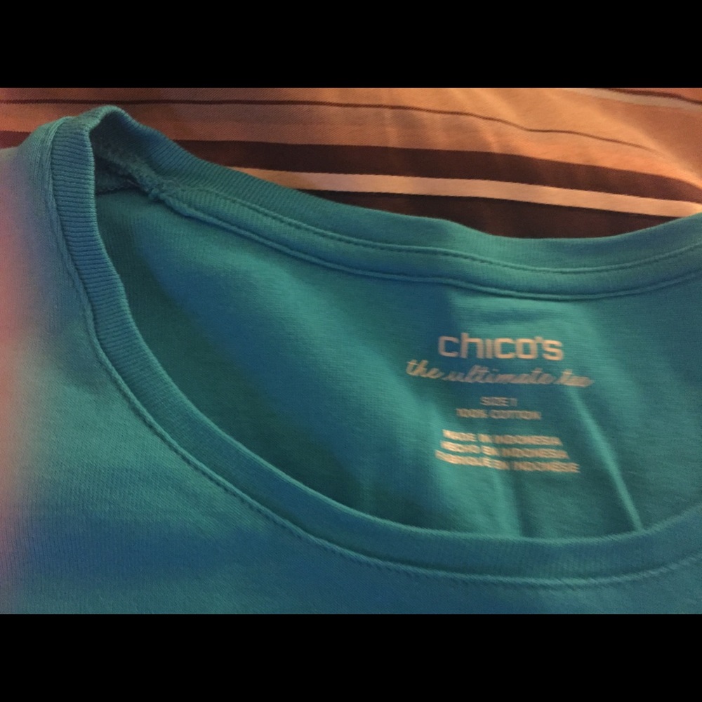 Teal colored shirt
