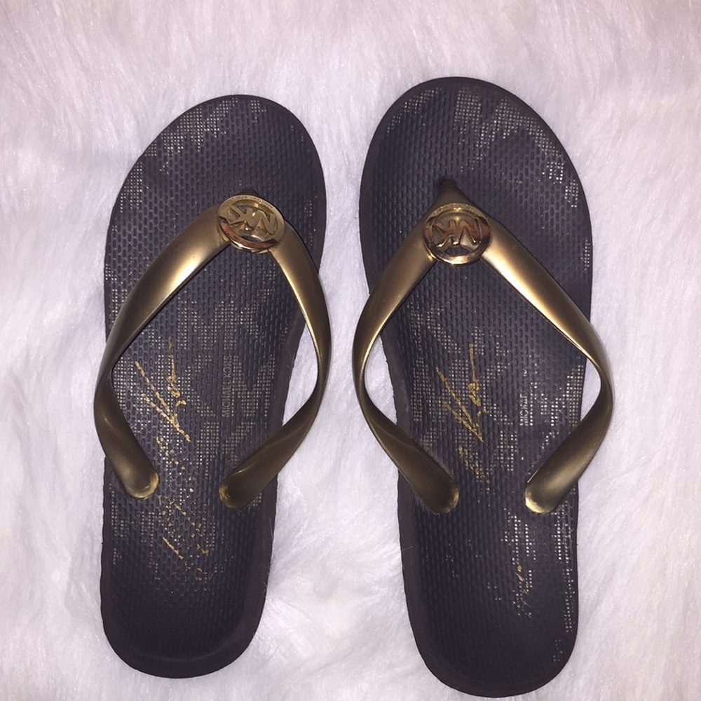 Michael Kors gold flip flops