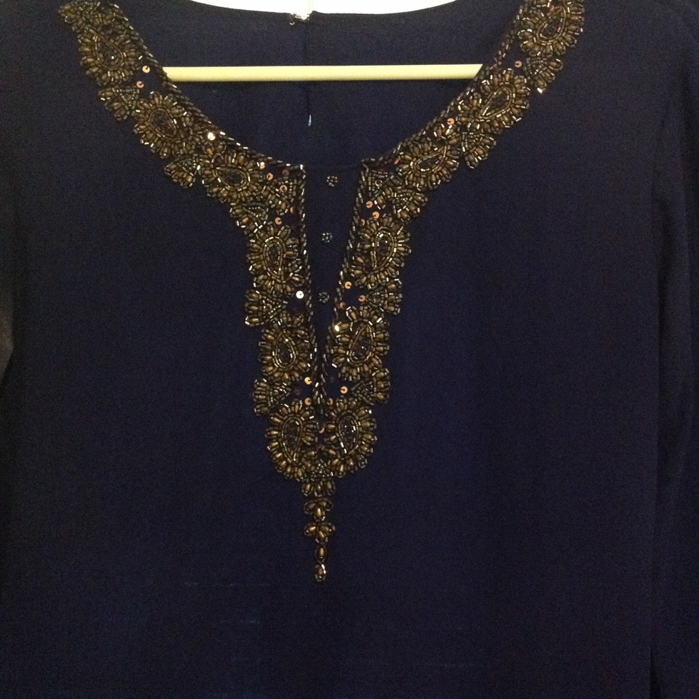 Blue outfit with embroidery designs