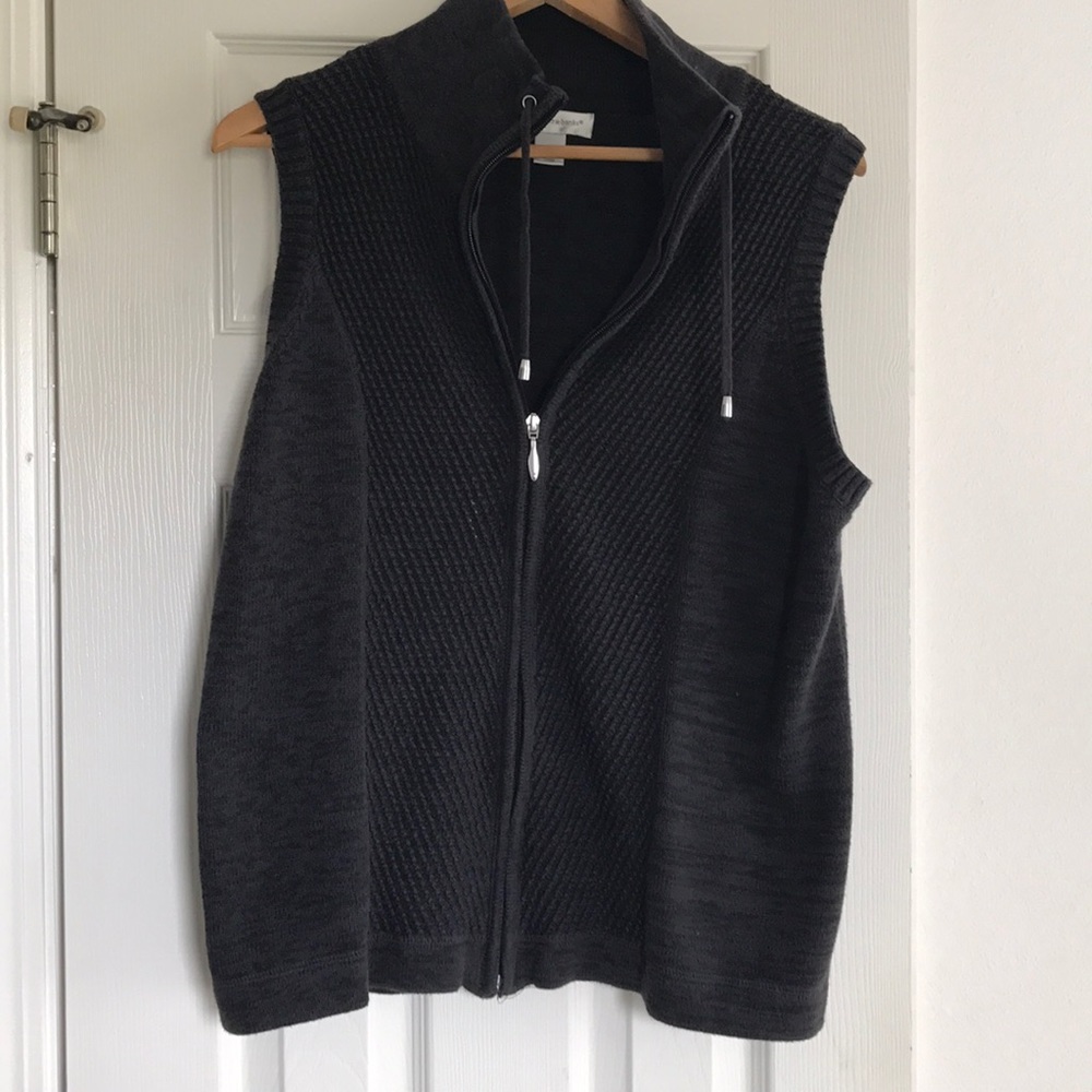 Zip up sweater vest.