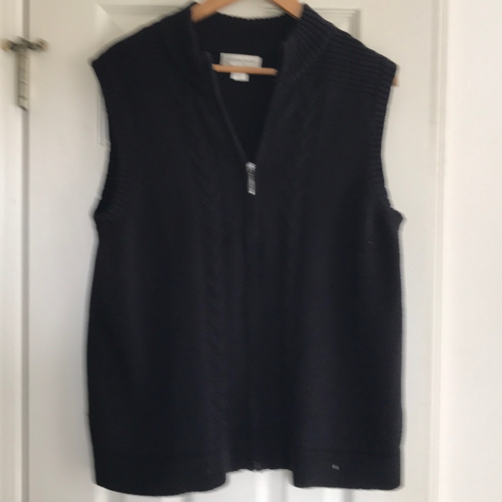 Zip up sweater vest.