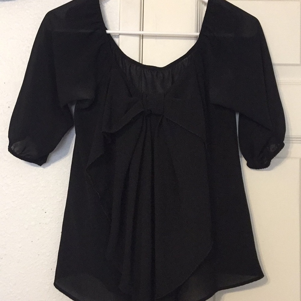 Stylish black bow blouse.