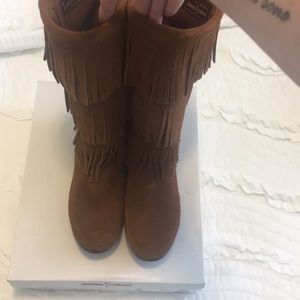 Tall Minnetonka moccasin boots.