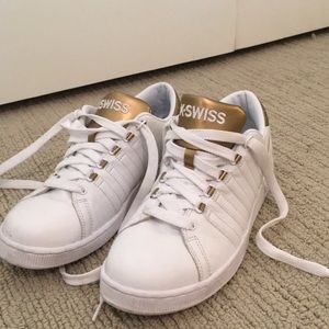 White and gold K-Swiss sneakers
