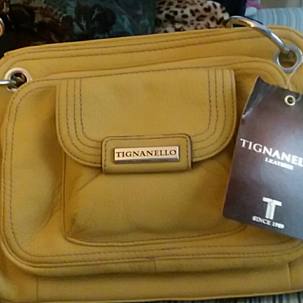 Tignanello leather Bag. Dark yellow w/ gold color hardware.