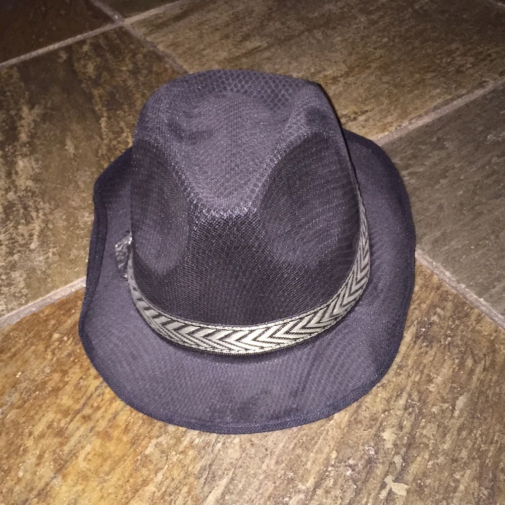 A black fadora with a gold lining