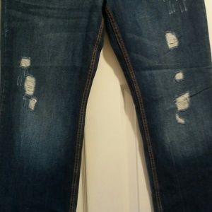Ladies Denim destresses/ ripped blue jean boot cut