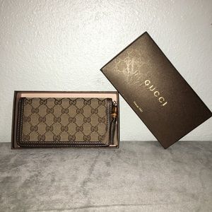 Gucci Monogram wallet with bamboo tassel