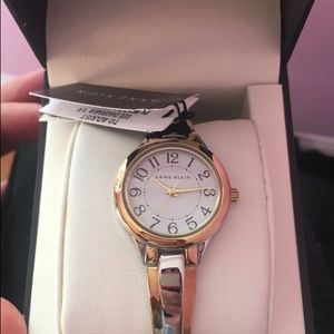 Round silver and gold Ann Klein analog watch
