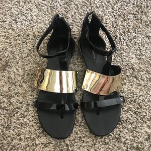 BCBGeneration Black and Gold Sandals