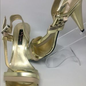 Nina metallic gold ankle strap heels.