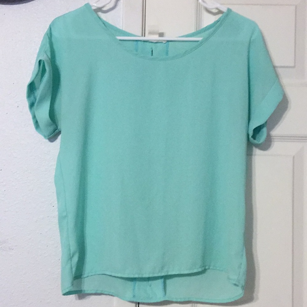 Light aqua blouse.