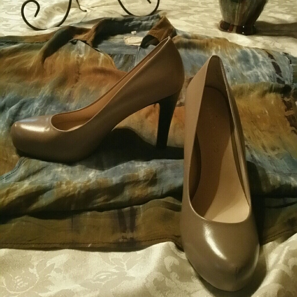 A pair of nude color pumps by Franco Sarto