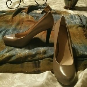 A pair of nude color pumps by Franco Sarto