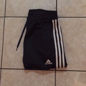 Adidas sweat pants.