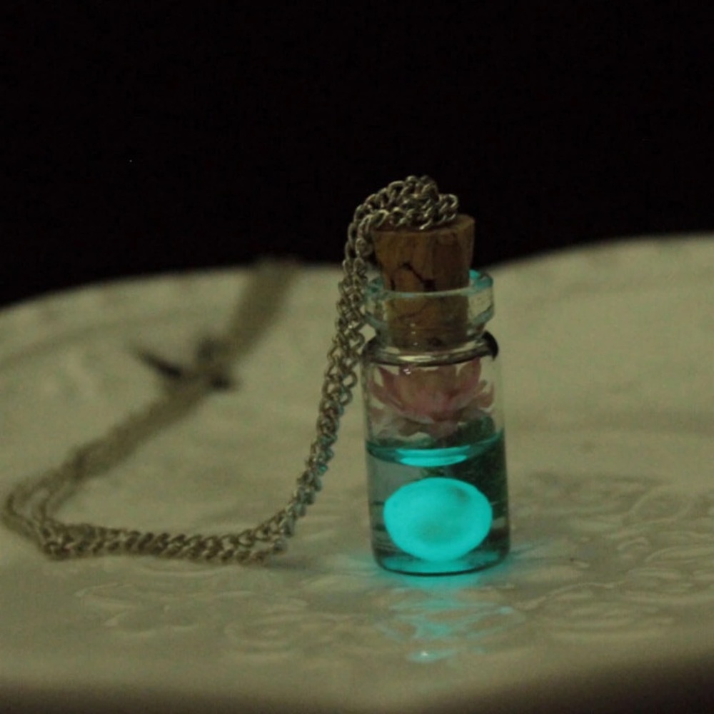 Luminous glass bottle charm necklace.