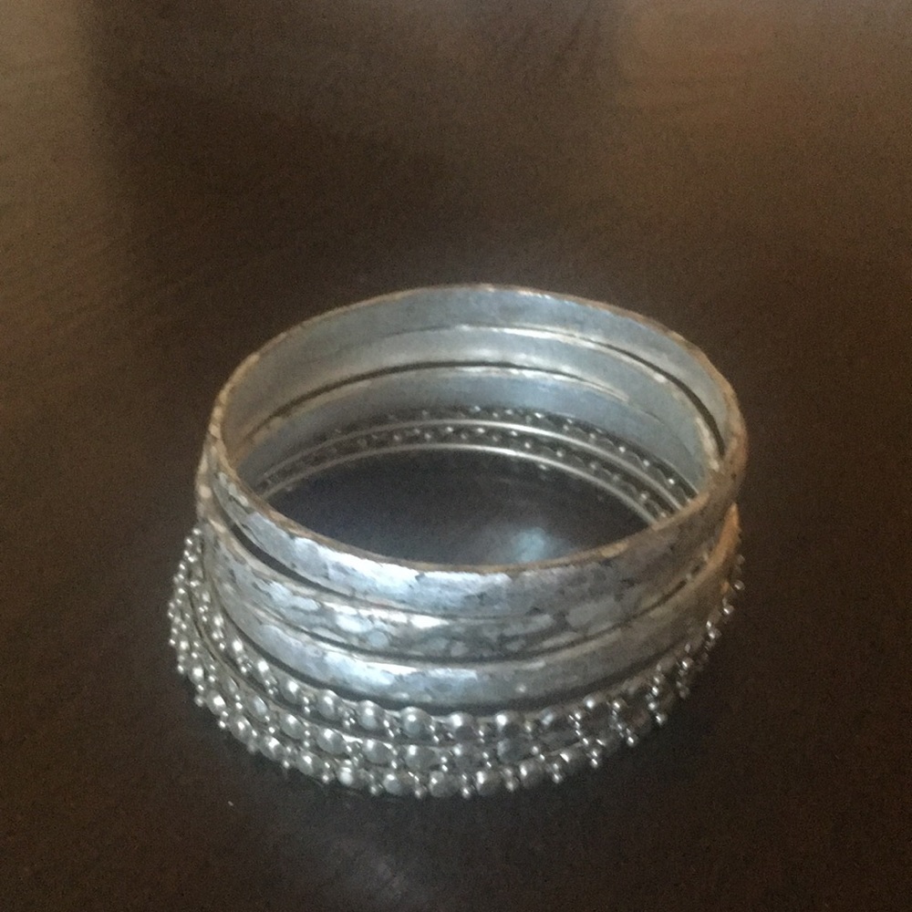 Two sets of silver bangles