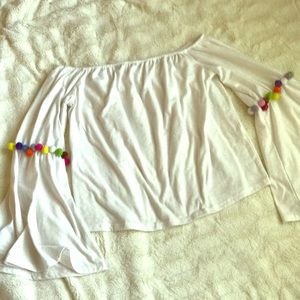 off shoulder bell sleeve top with pom poms