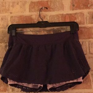 Purple Luke on running tennis skort
