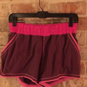 Size 6 lululemon pink black stripe running shorts