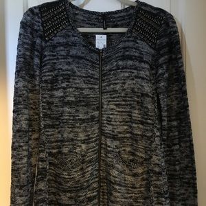 Edgy zip up sweater with metal details