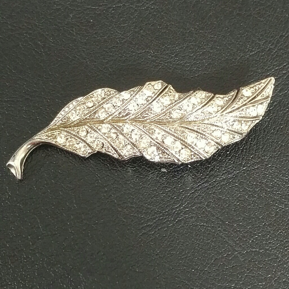 Vintage silver toned and rhinestone leaf brooch
