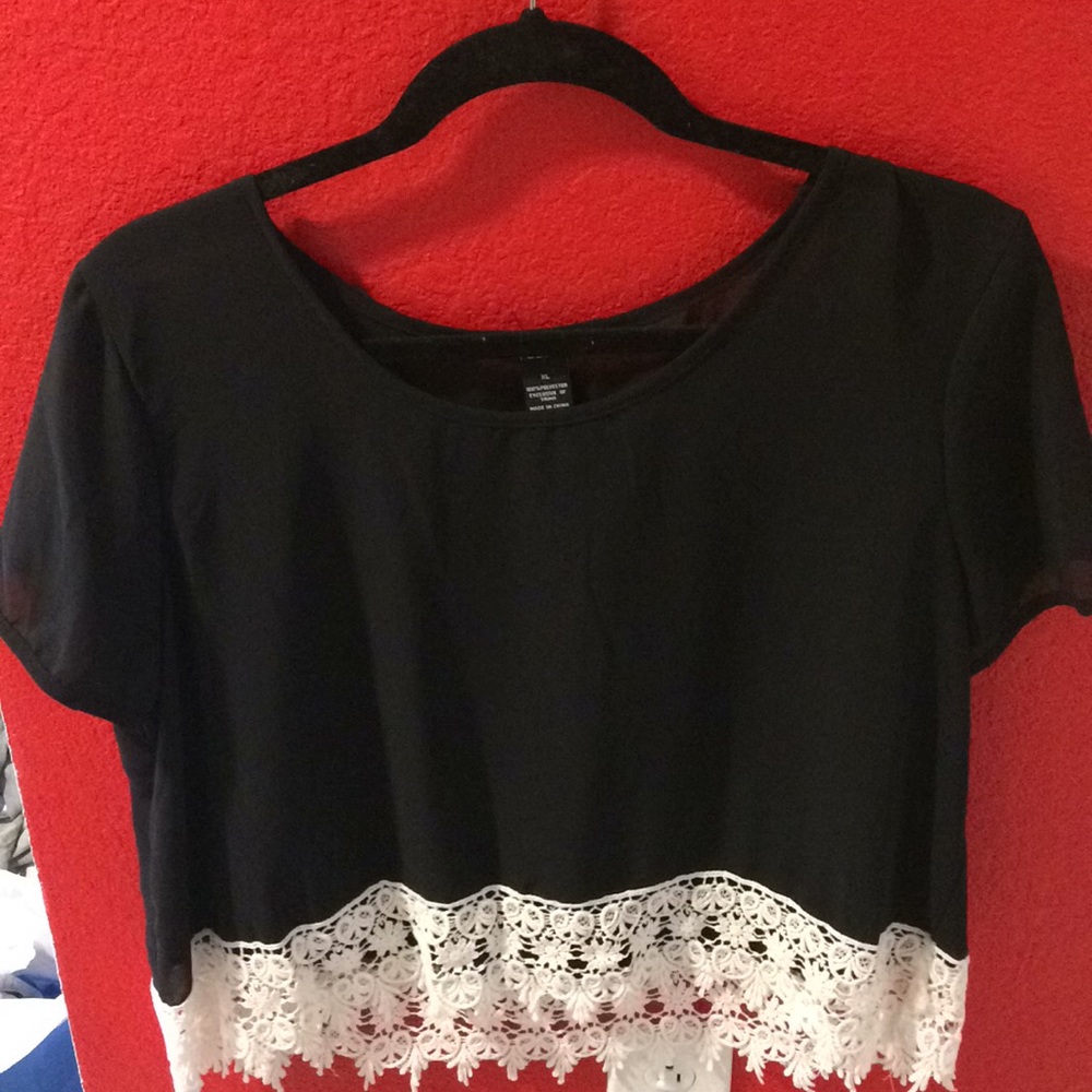 Black crop top with lace bottom.