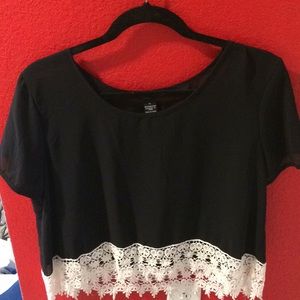 Black crop top with lace bottom.