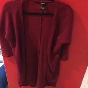 Maroon/red cardigan.