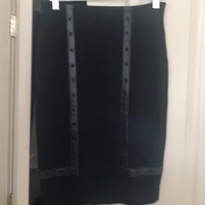 Bebe black skirt with genuine  leather trim