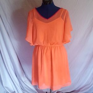 Orange chiffon midi dress with pink lining.