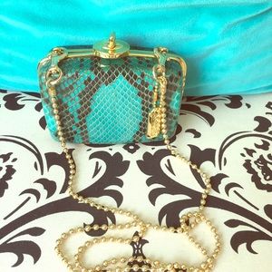 Coach mini exotic snakeskin clutch